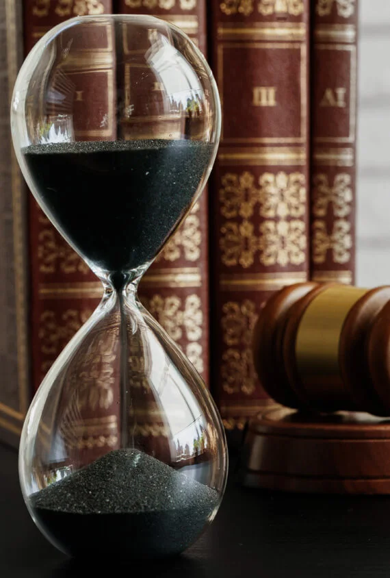 court-concept-hourglass-and-judge-gavel-on-table-C29WNTL.jpg